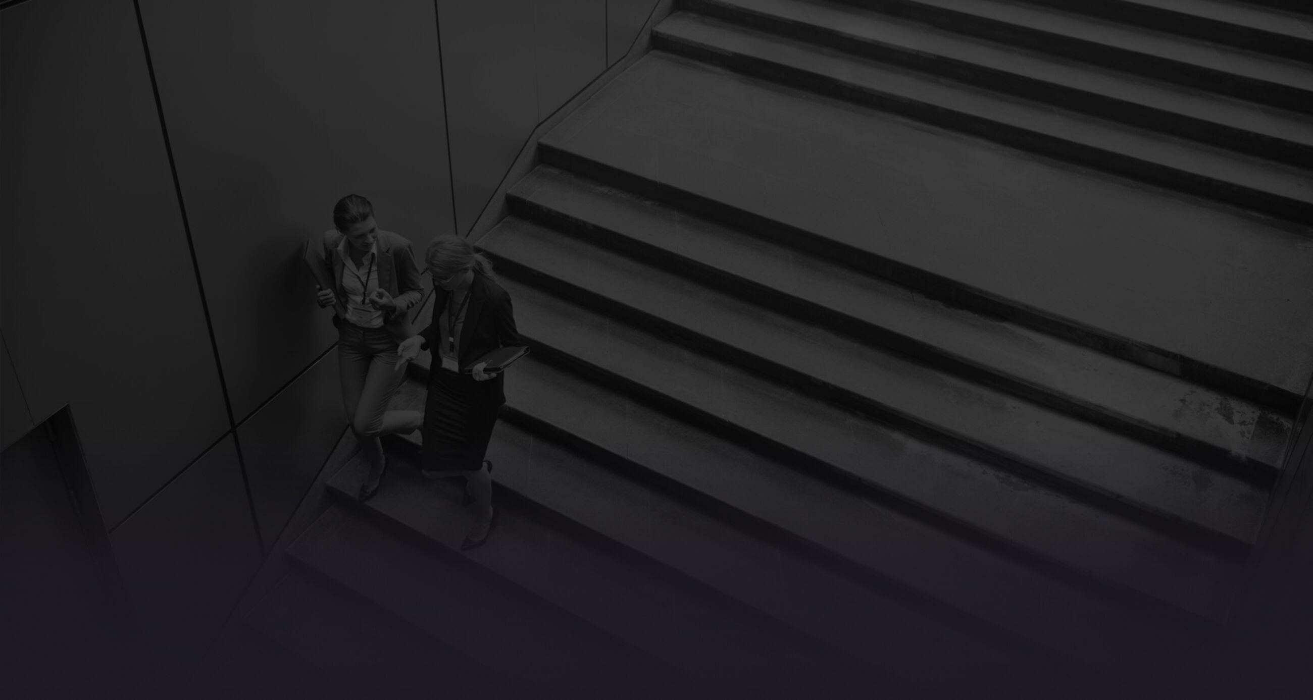 Businesswoman talking while walking down the stairs