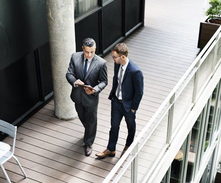 Businessmen walking and talking