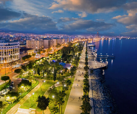 Bird's-eye view evening panorama of Limassol, Cyprus, illuminated by lanterns
