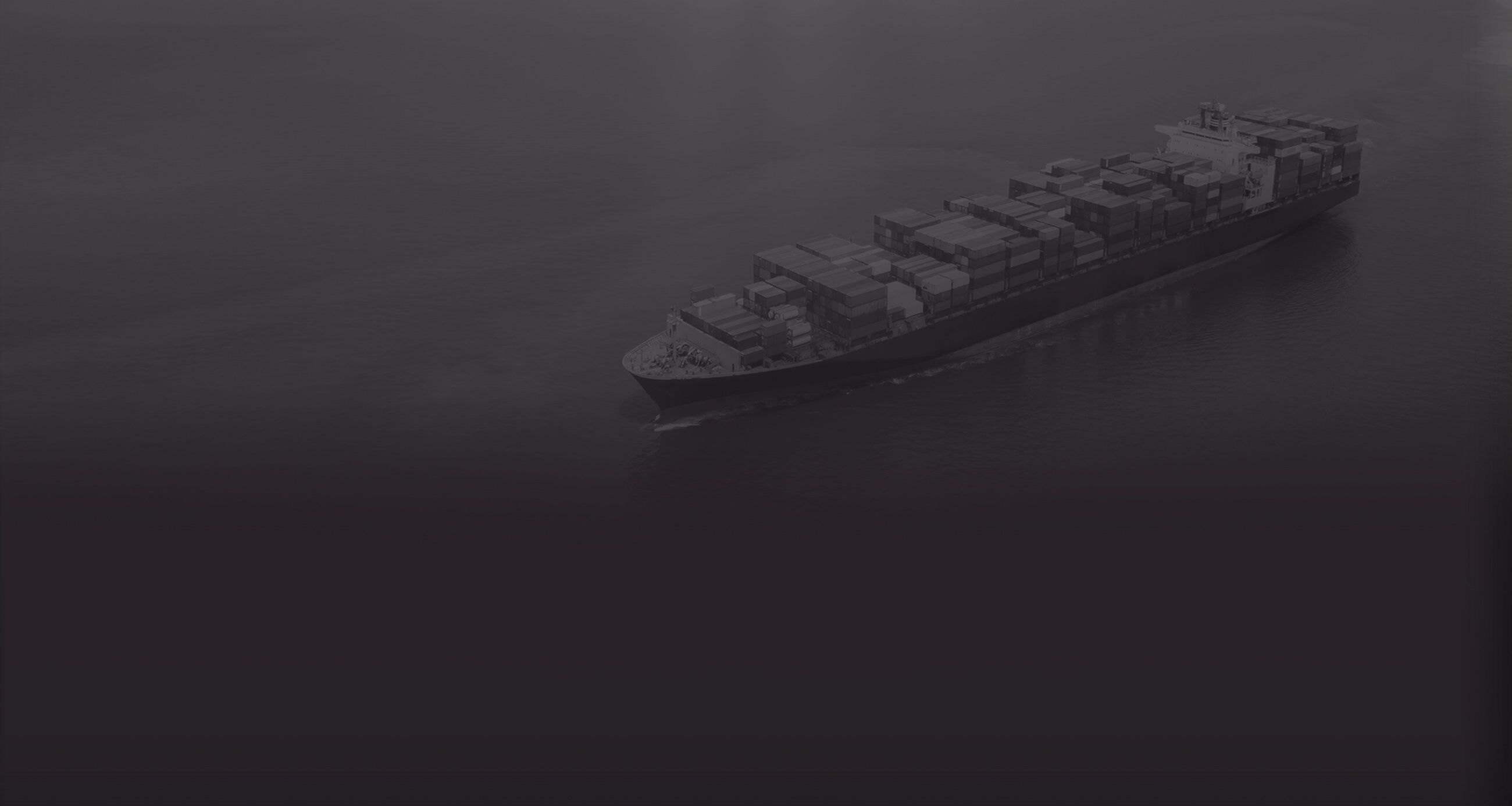 Container cargo ship at sunset