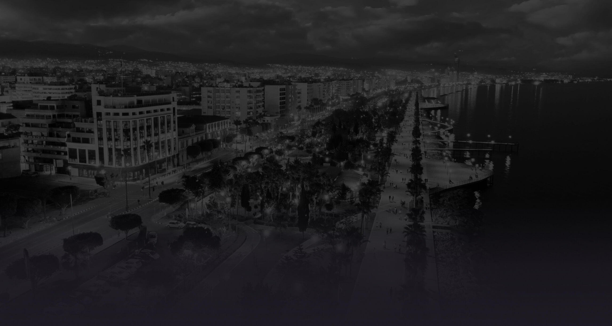 Bird's-eye view evening panorama of Limassol, Cyprus, illuminated by lanterns