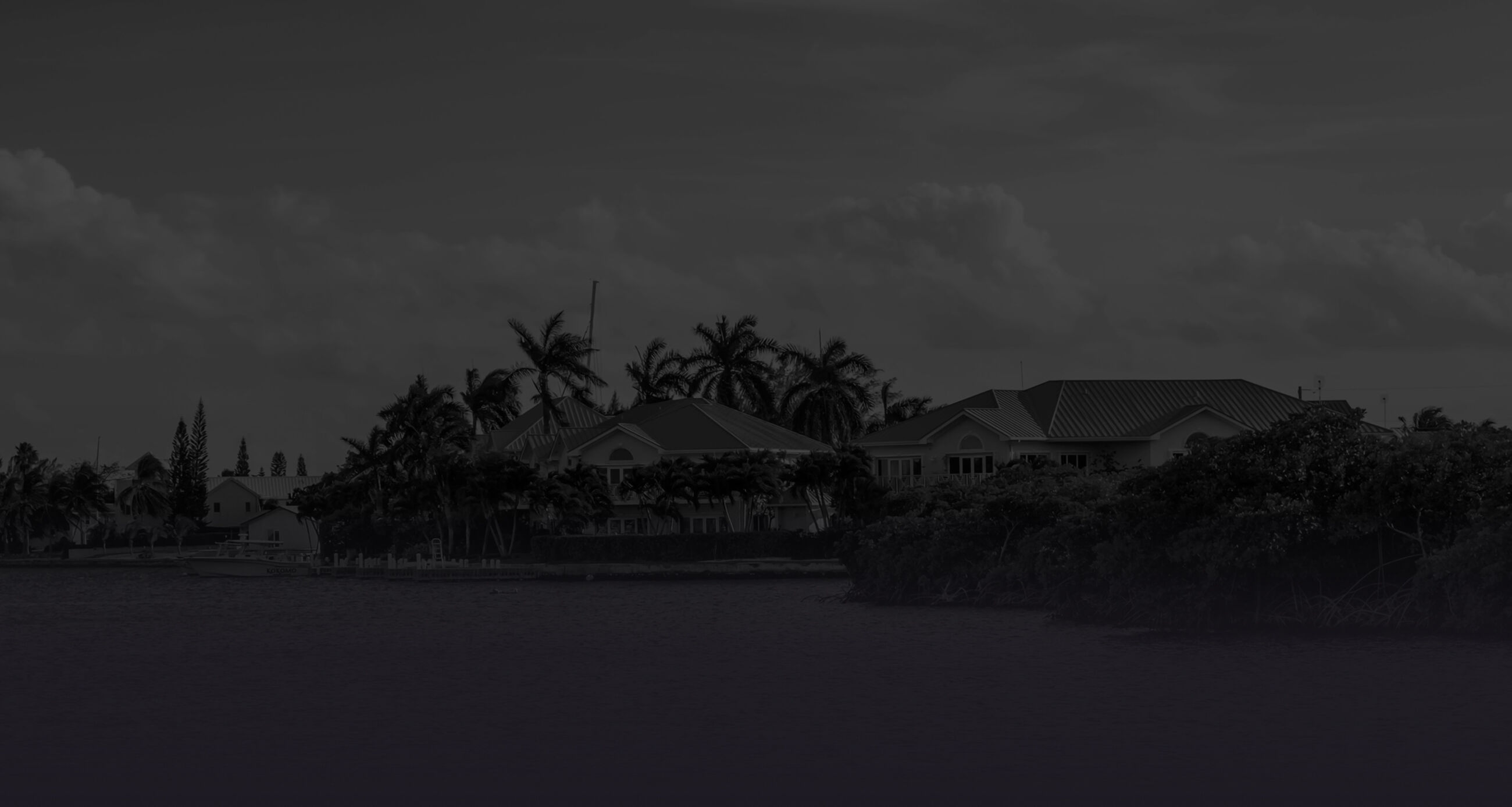 Houses by the Caribbean Sea in the residential area of Governors Creek in Grand Cayman, Cayman Islands