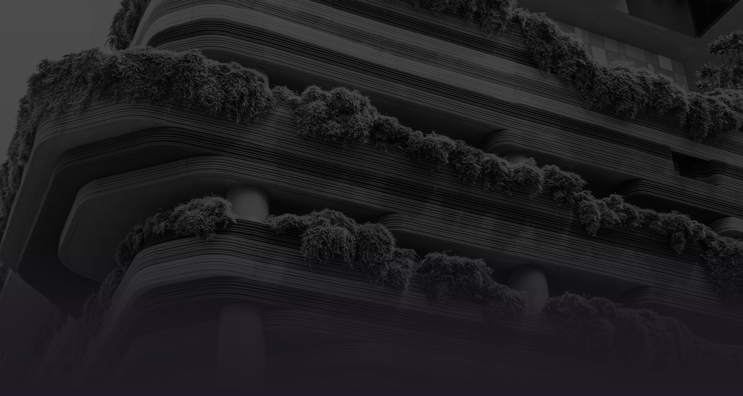 Close up of a business building with plant decorated balconies